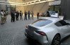 Toyota Supra designers review a scale model in the viewing area
