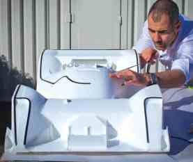 Daniel Simon works on a foam model of the Masucci race car for Timeless Racer