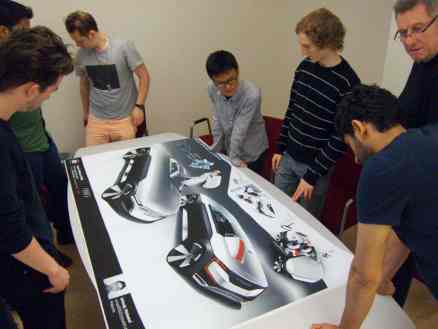 students meet to discuss the development process